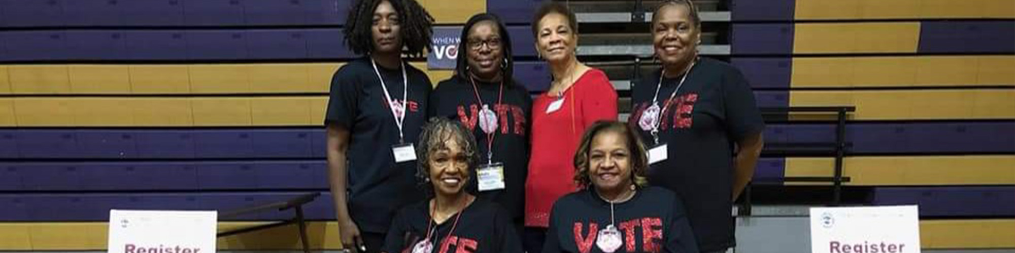 Six members of Delta Sigma Theta members and five wearing black VOTE t-shirts